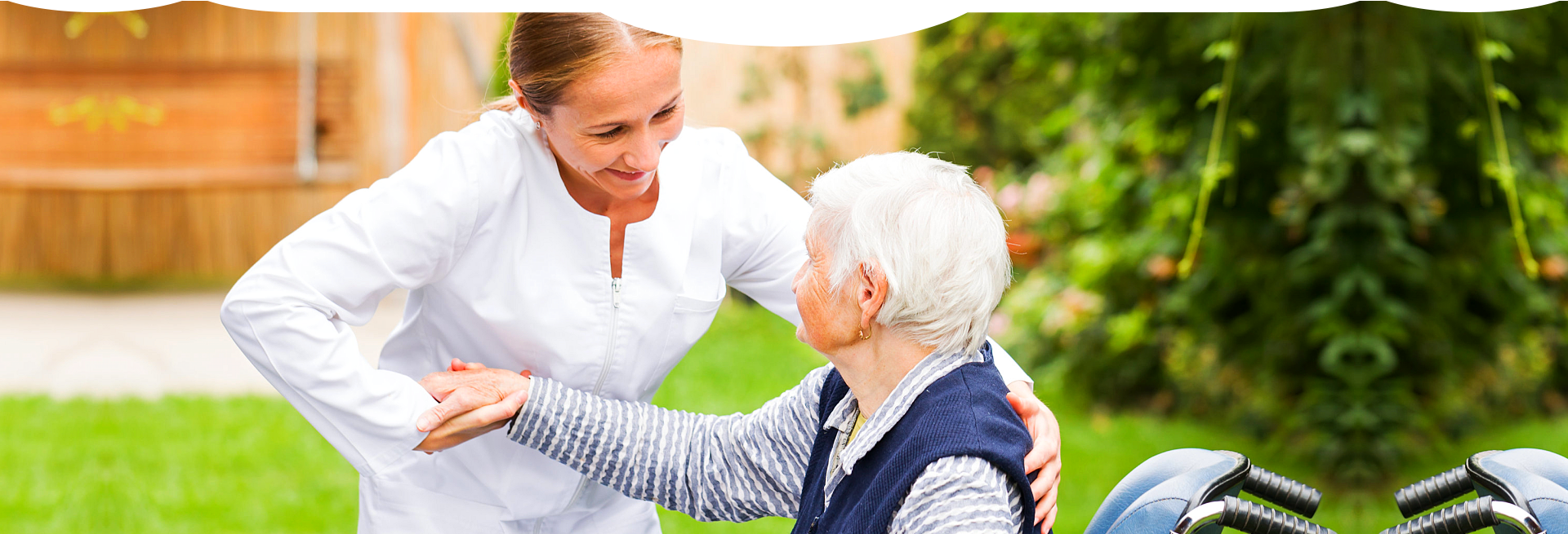 caregiver giving support to a sitting patient