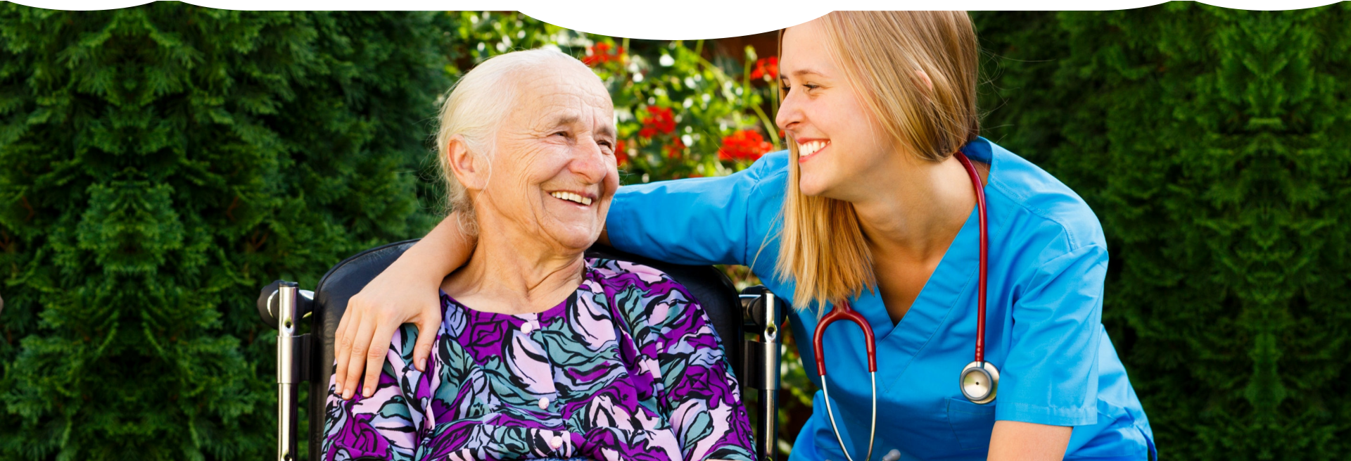 caregiver and patient smiling and looking at each other