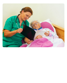 caregiver showing a xray result to old woman